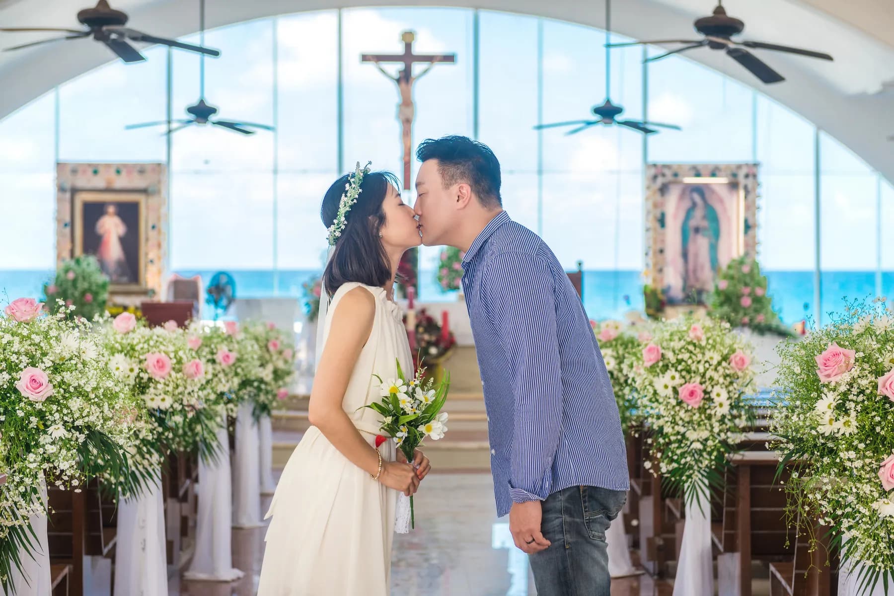 Couple kissing in a seaside chapel on Isla Mujeres