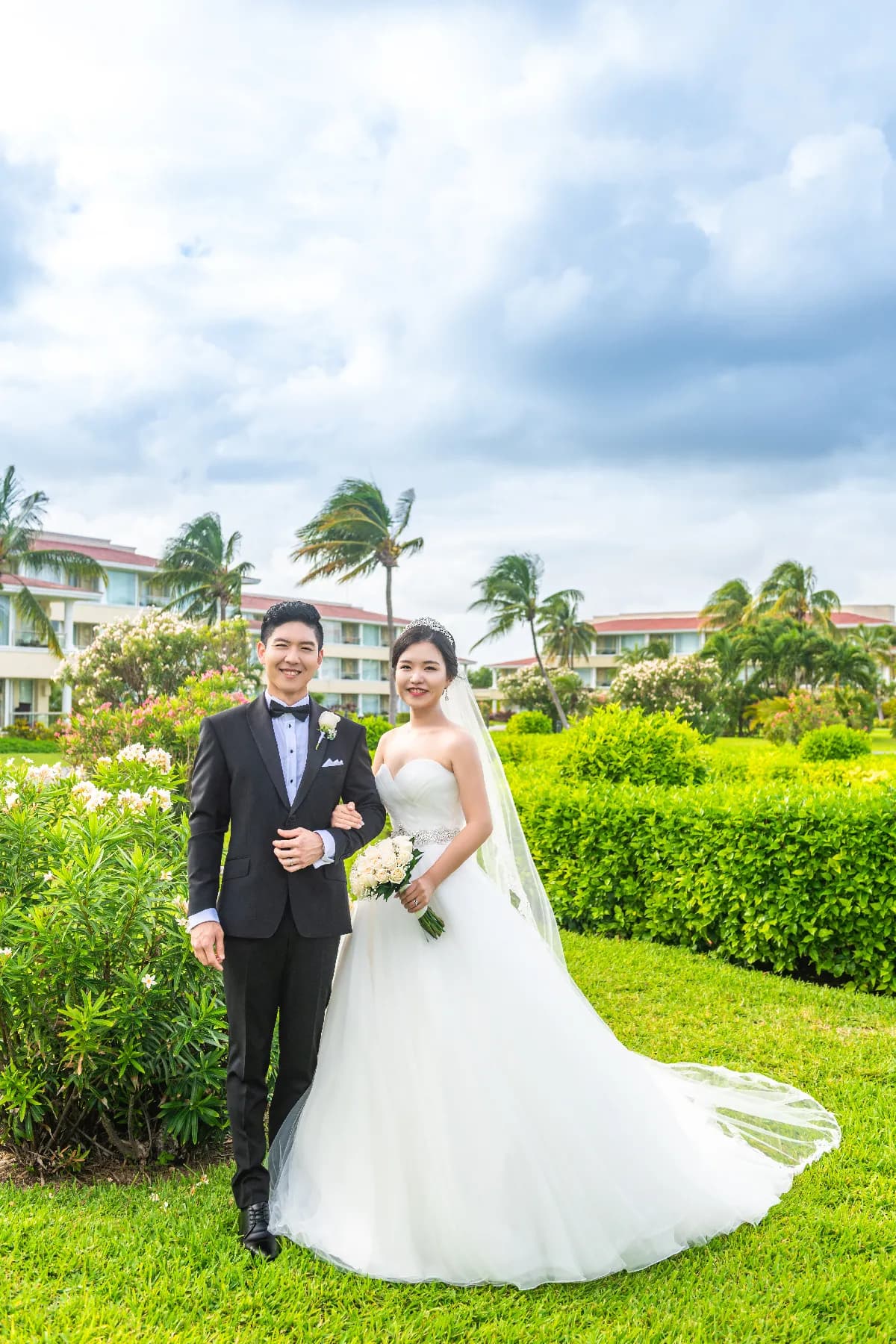 Cancun resort wedding portrait in a palm garden